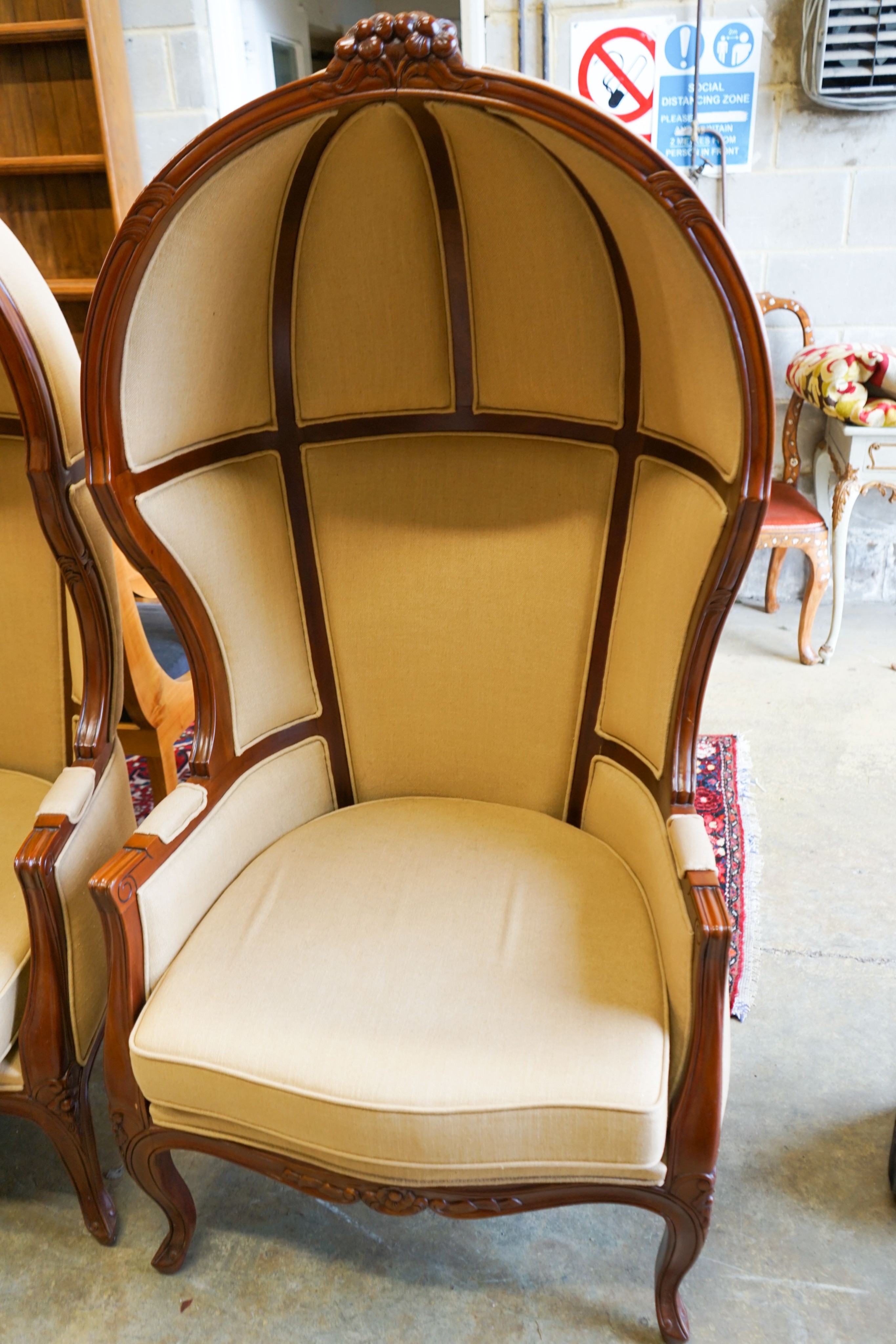 A pair of Victorian style upholstered carved mahogany hall porter's chairs, width 80cm, depth 66cm, height 162cm